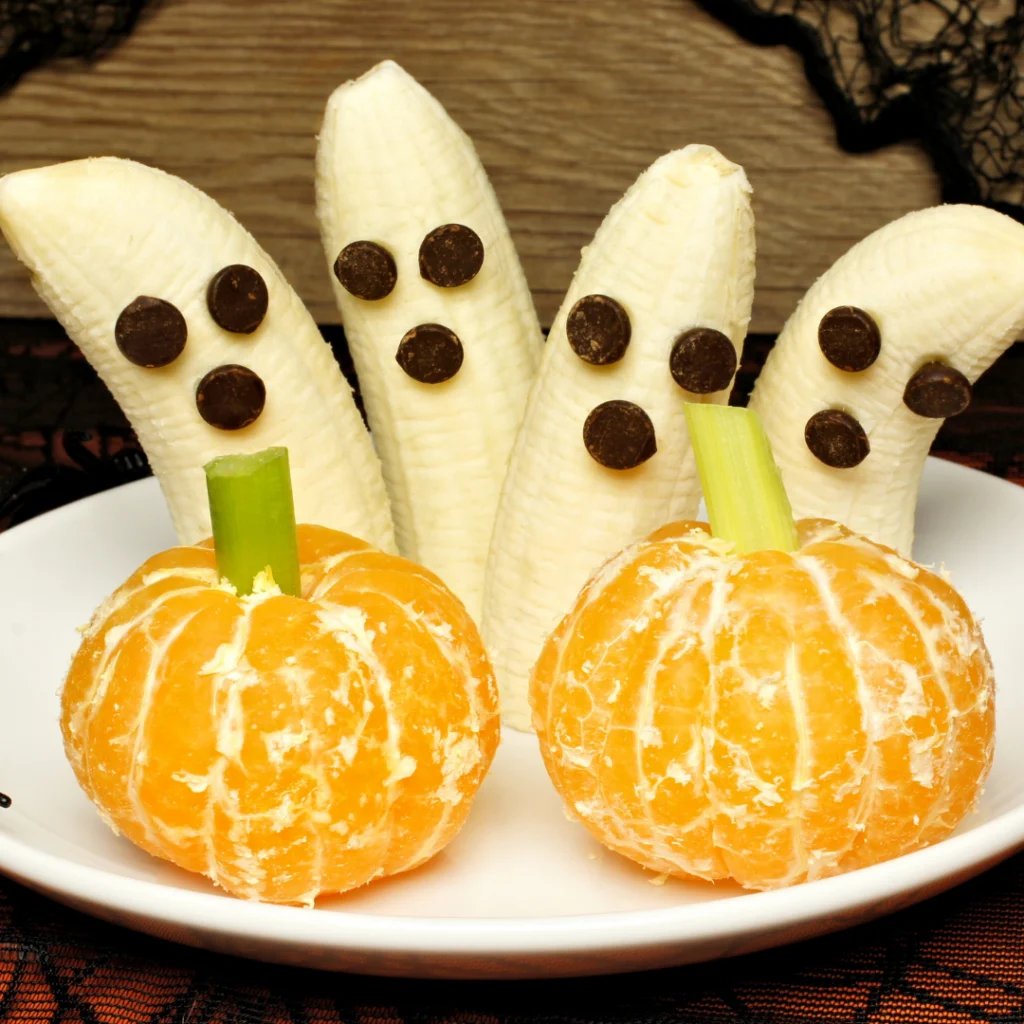 Banana ghosts with tangerine pumpkins